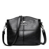 Tyylikäs kirjailtu nahkainen kantolaukku ja crossbody-laukku naisille