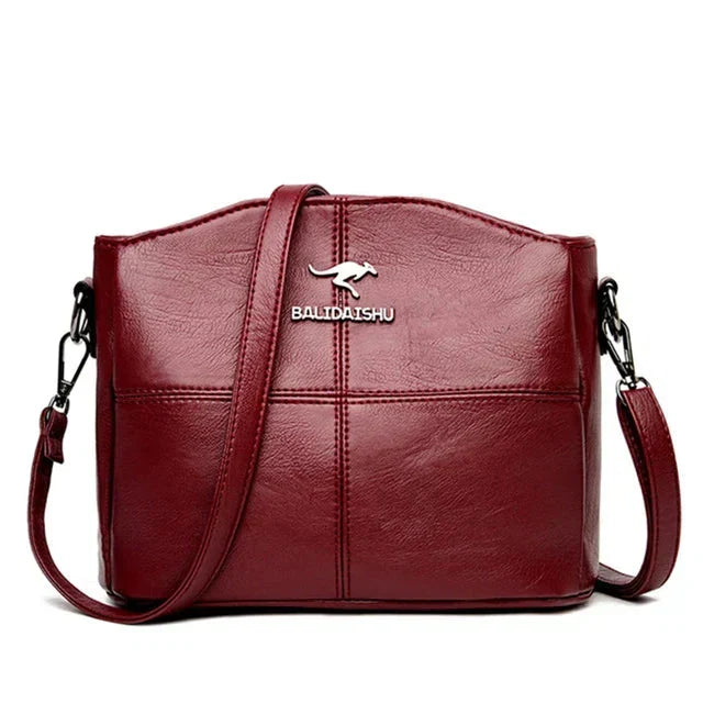 Tyylikäs kirjailtu nahkainen kantolaukku ja crossbody-laukku naisille