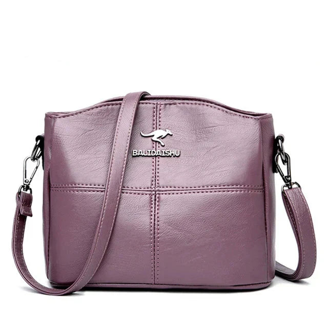Tyylikäs kirjailtu nahkainen kantolaukku ja crossbody-laukku naisille